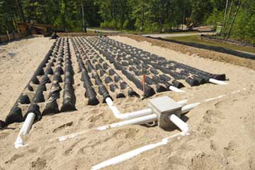 Septic system installation with installation of new drain field.